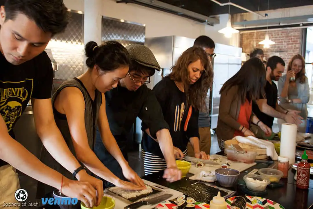 Sushi class - students rolling sushi