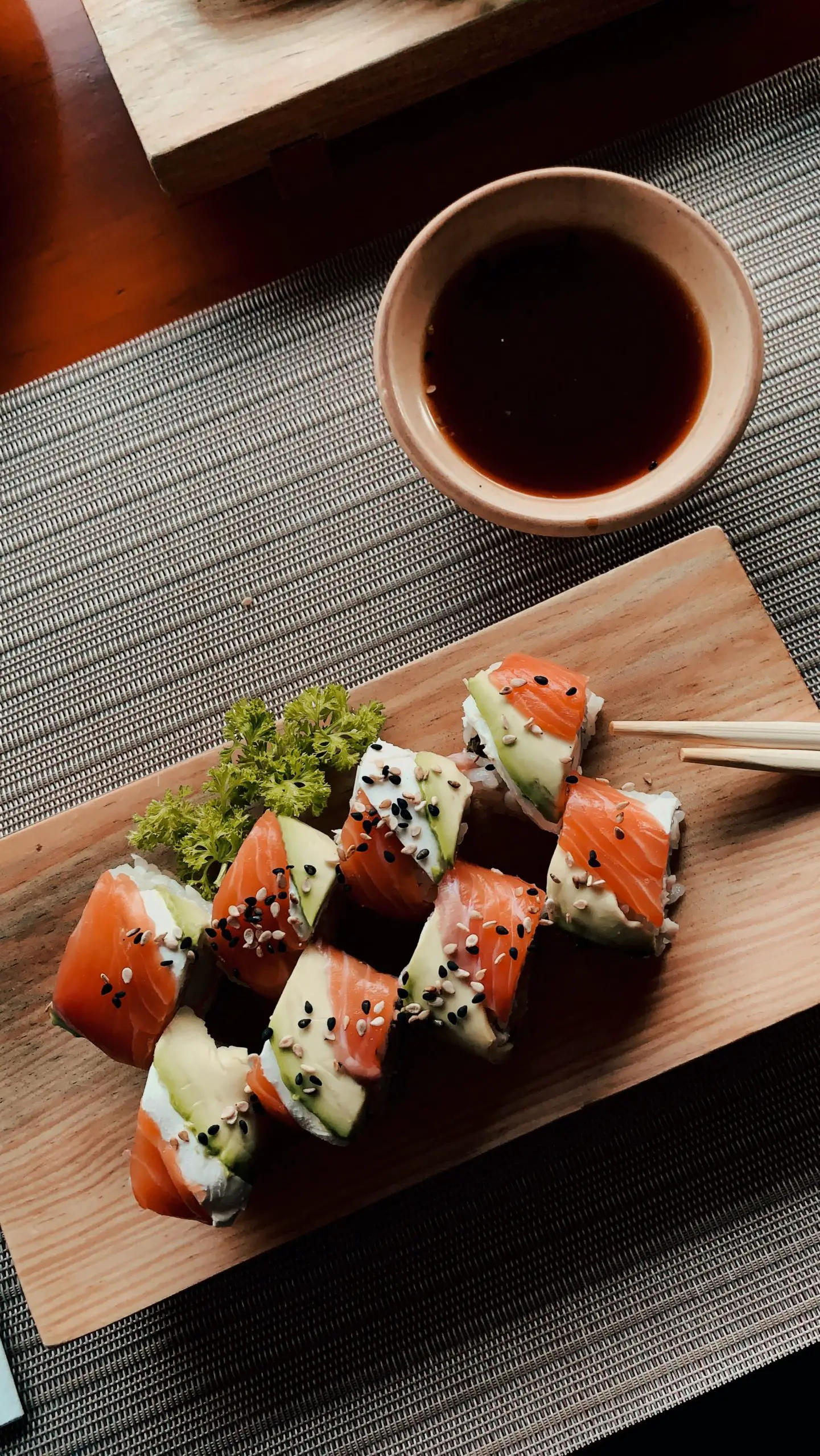 Sushi Roll Recipes - custom sushi roll on a bamboo plate.